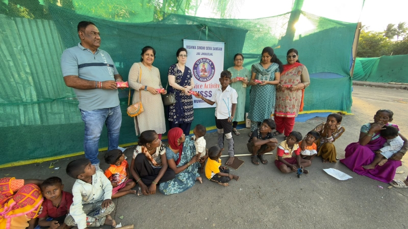 Distribution of cream rolls 2nos each to poor and needy children.